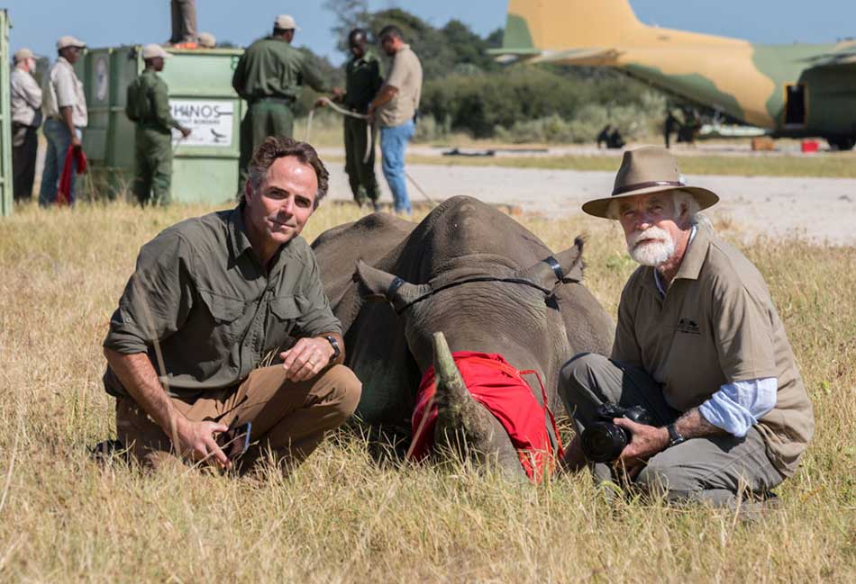 Joss Kent and Derek Joubert at the release of rhinos in Botswana – courtesy of David Murray
